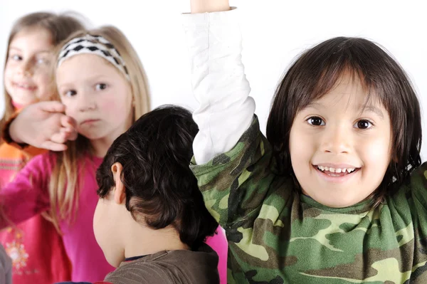 Grupo de niños juguetones en el estudio —  Fotos de Stock