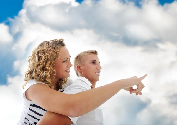 Portrait of teenage couple having piggyback ride together — Stock Photo, Image