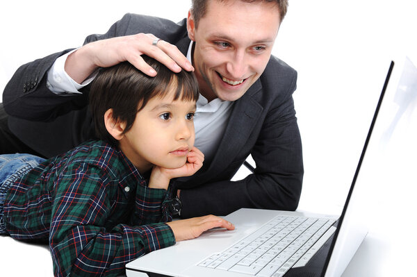 Father and son using laptop