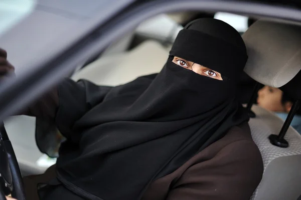 Muslim middle eastern female driver wearing veil Stock Photo