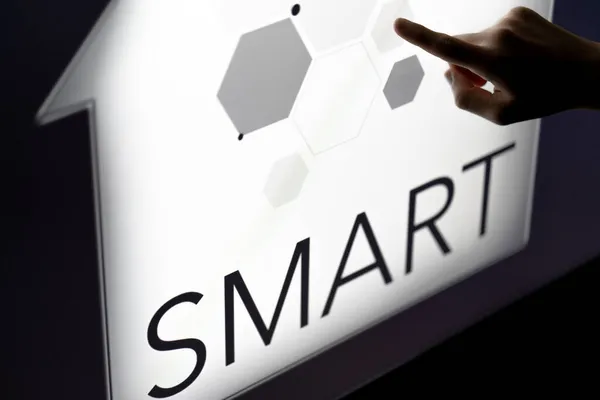 Man touching a smart home concept on a touch screen with his finger — Stock Photo, Image