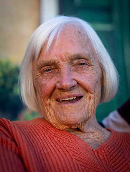 Aged candid woman close up portrait , high quality photo 