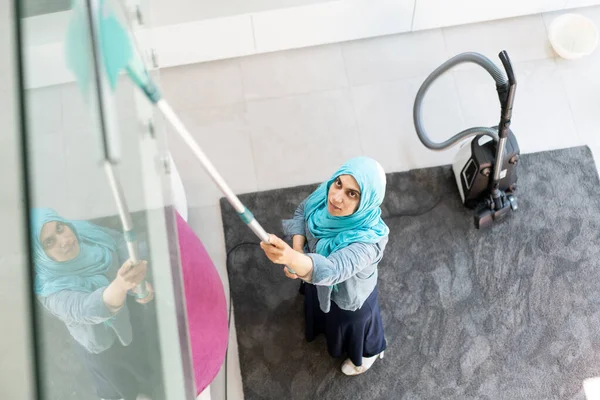 Happy Muslim Woman Cleaning Modern House Living Room Stock Picture