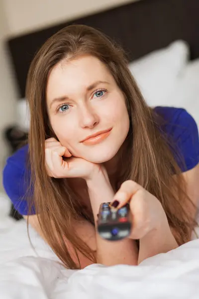 Beautiful caucasian girl with TV console