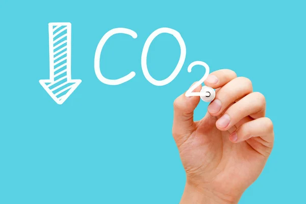 Hand drawing concept about reducing Carbon Dioxide CO2 emissions and carbon footprint.