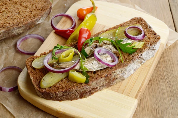 Sandwich with pickled vegetables and sprat — Stock Image Sandwich with pickled vegetables and sprat Royalty Free Stock Photos