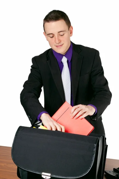 Businessman packing his briefcase — Stock Photo, Image
