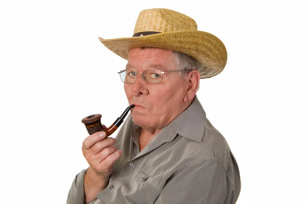 Yaşlı adam şapka ve boru — Stok fotoğraf