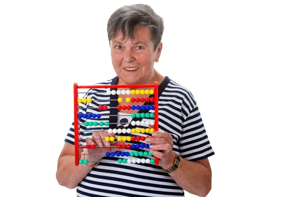 Senior woman calculating with abacus — Stock Photo, Image