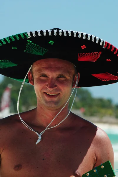 Man in sombrero playing guitar — Stock Photo, Image