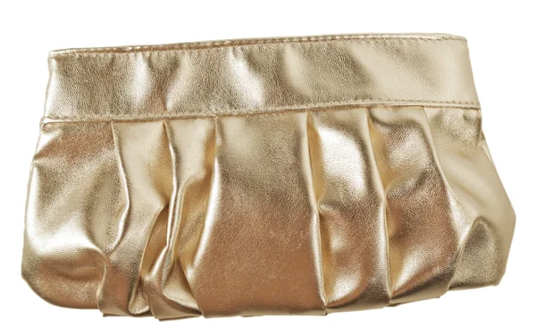 Золотая косметическая сумка — стоковое фото