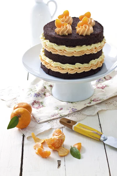 Ciasto czekoladowe i mandarynka — Zdjęcie stockowe