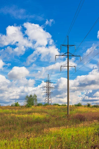High voltage lines and cloudy sky — Stock Photo, Image