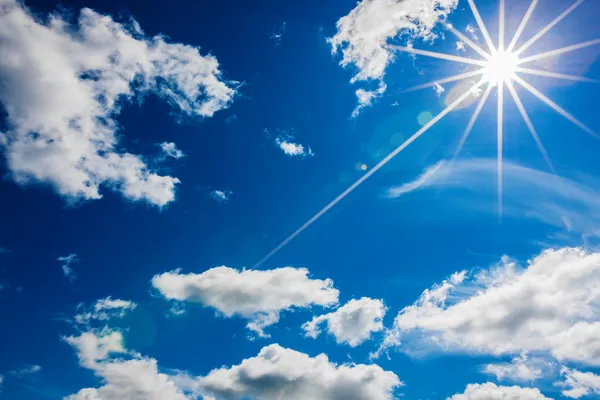 White clouds with sun in the blue sky — Stock Photo, Image