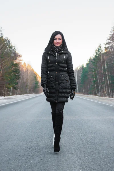 Young woman on the road — Stock Photo, Image