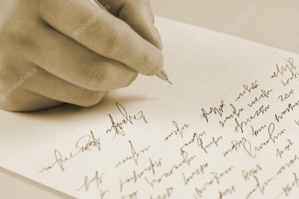 Male hand writing on a paper