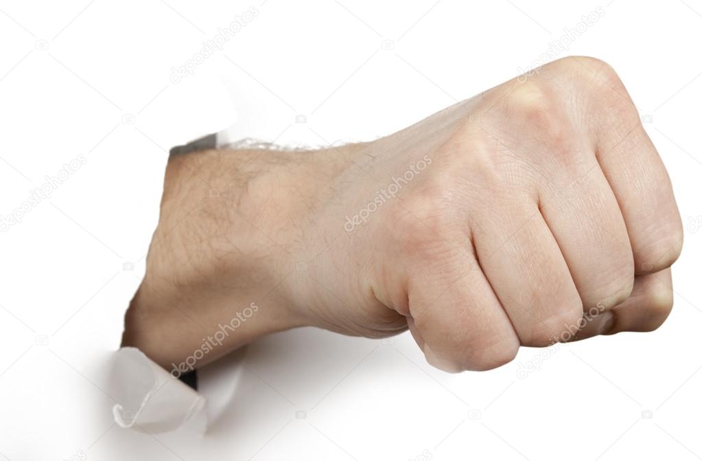 Fist punching paper isolated on white background