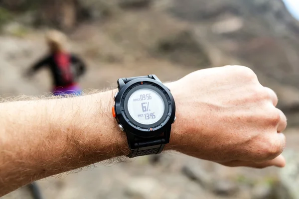 Runner looking at sport watch — Stock Photo, Image