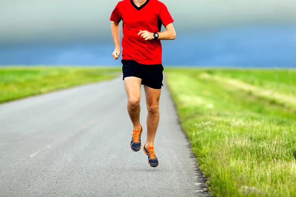 Man running on country road — Stock Photo, Image