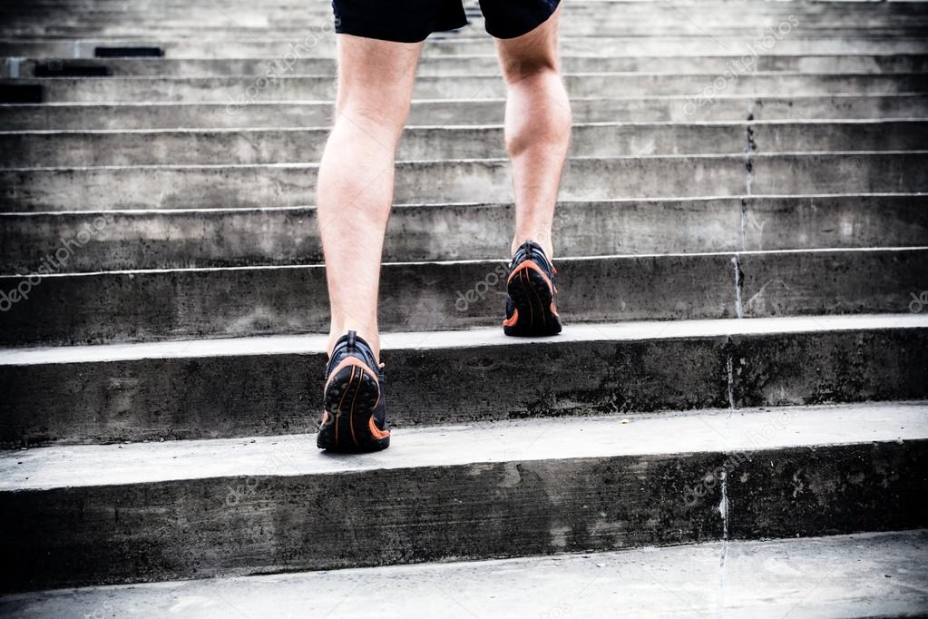 Jogger running on stairs, sports training