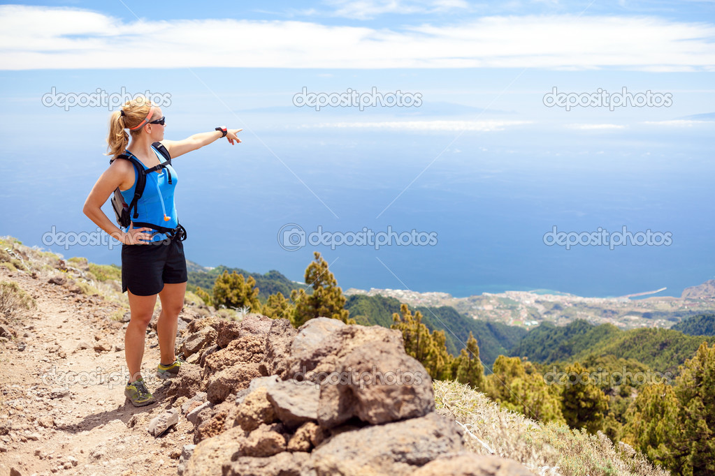 Hiking woman, runner in summer mountains