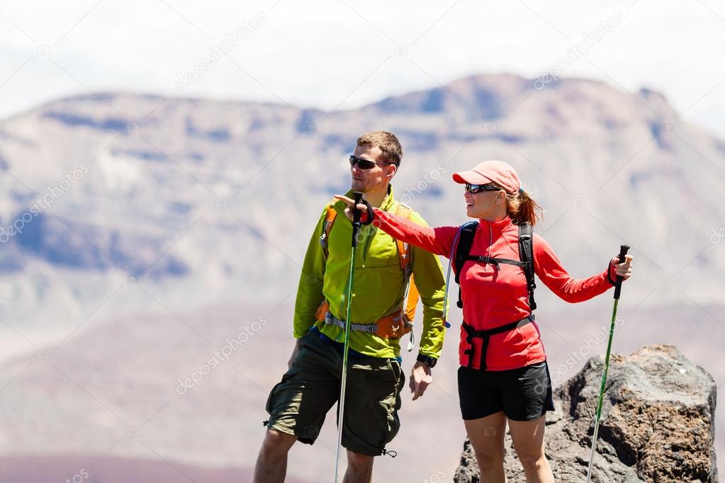 Couple hikers in high mountains