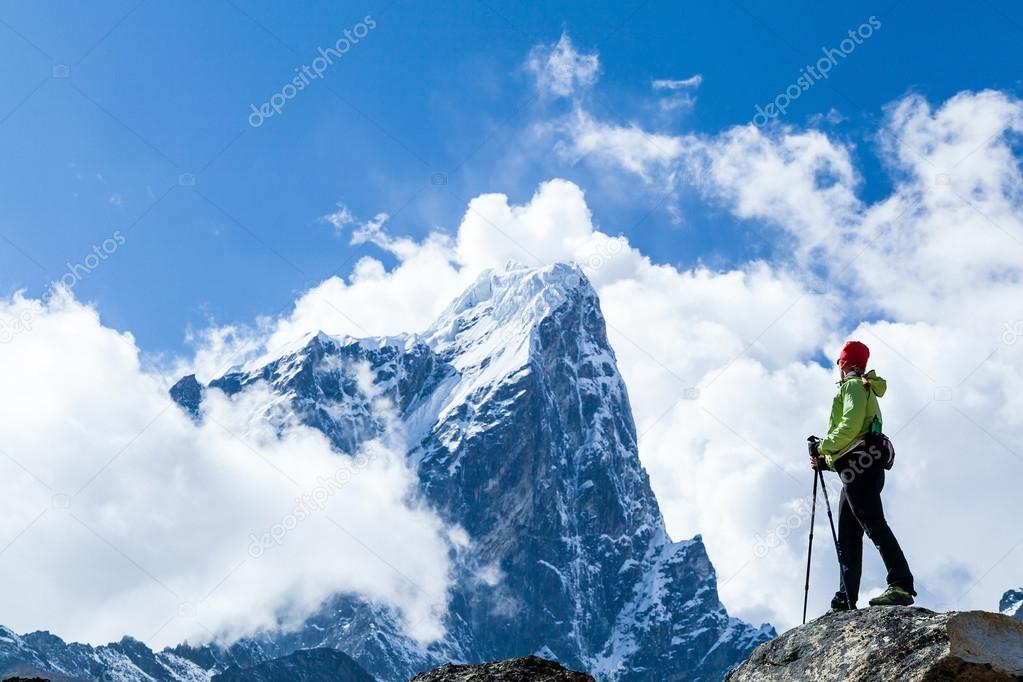 Woman hiker in mountains