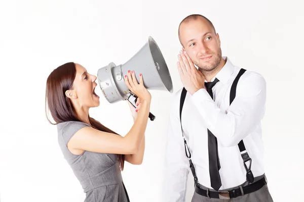 Businesswoman shouting at a businessman with megaphone — Stock Photo, Image