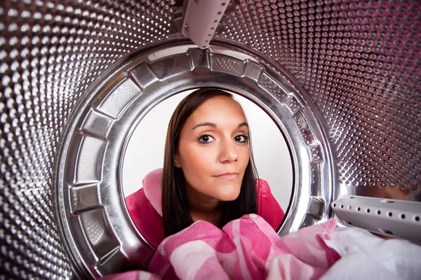 Young woman doing laundry View from the inside of washing machine. — Stock Photo, Image