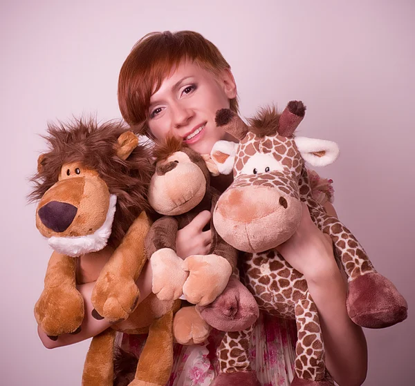 Menina com brinquedos — Fotografia de Stock