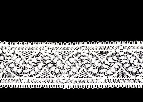 White lace on a black background — Stock Photo, Image