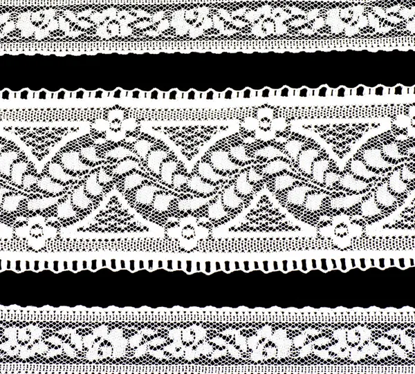 White lace on a black background — Stock Photo, Image