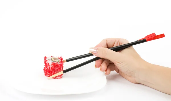 Comida tradicional japonesa Sushi en la mano sobre fondo blanco — Foto de Stock