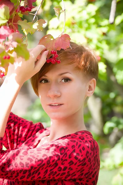 Beautiful young woman in spring garden — Stock Photo, Image