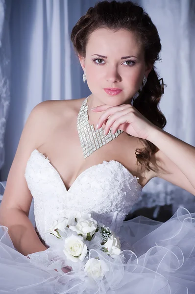 Beautiful bride with stylish make-up in white dress — Stock Photo, Image