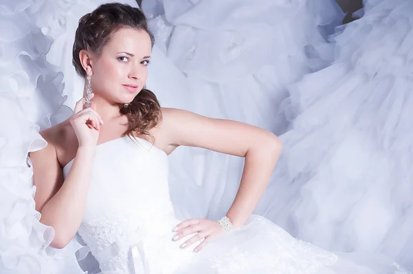 Beautiful bride with stylish make-up in white dress — Stock Photo, Image