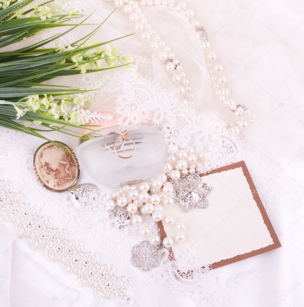 White lace with flower, golden jewelry and antique cameo