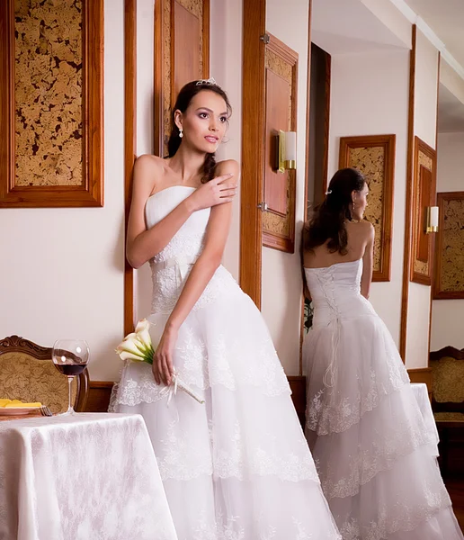 Beautiful bride with stylish make-up in white dress — Stock Photo, Image