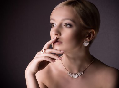 Portrait of beautiful young woman with jewelry clipart