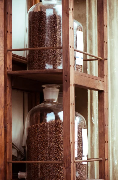 Coffee cans on the shelves — Stock Photo, Image