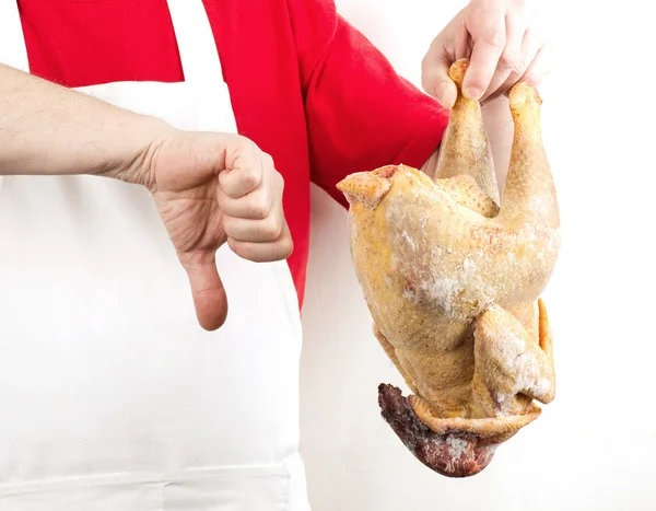 Homem cozinheiro tem uma galinha — Fotografia de Stock
