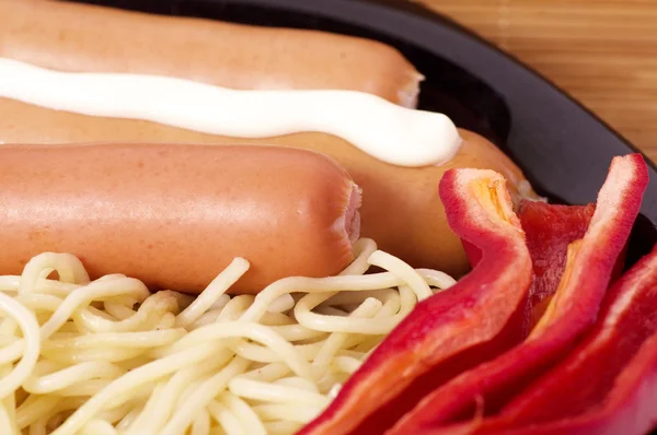 Sausages and pasta — Stock Photo, Image