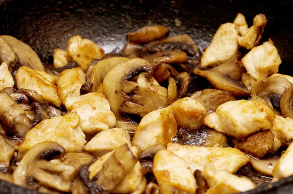Fried mushrooms in a pan closeup — Stock Photo, Image