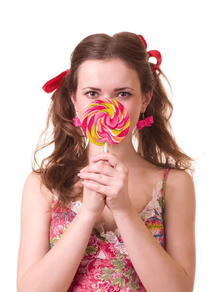 Mooi meisje met roze spiraal lollies — Stockfoto