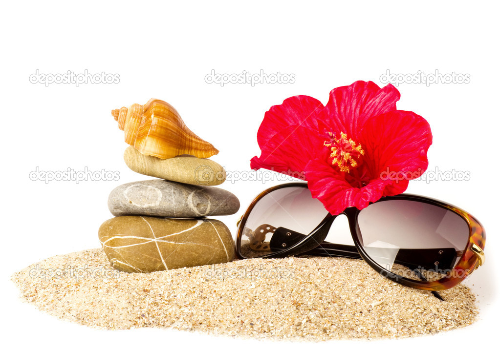 Eautiful exotic shell, crystals and glasses on sand