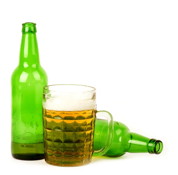 Glass of beer and two empty bottles — Stock Photo, Image