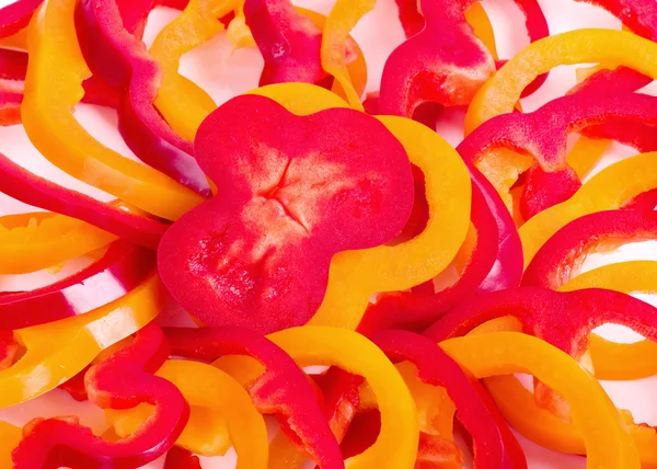 Achtergrond van zoete paprika ringen, gesneden — Stockfoto