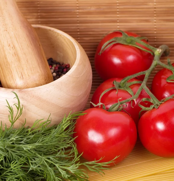 Wooden mortar with tomatoes and dill — Stock Photo, Image