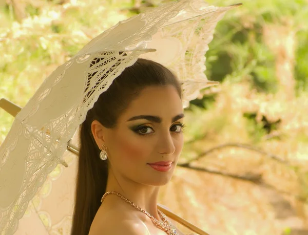 Beautiful bride with stylish make-up in white dress — Stock Photo, Image