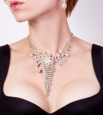 Woman breast with jewelry clipart